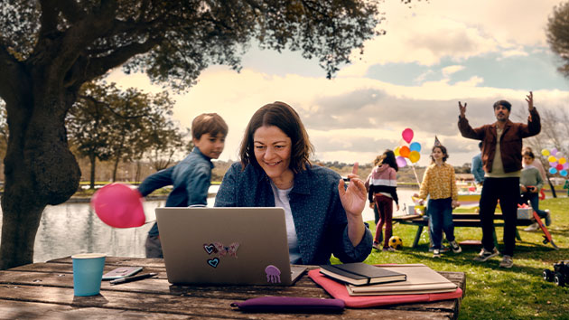 Woman working during a family occasion